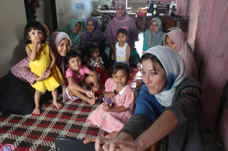 Brianna in a meeting with some of her artisans