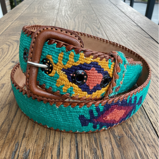 Colorful belt with intricate patterns on a wooden surface