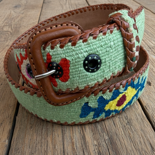 Colorful belt with floral pattern on a wooden surface