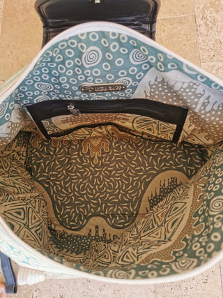 Patterned bag with visible brand name on a textured surface