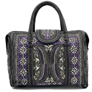 Patterned handbag with purple and black design on a white background