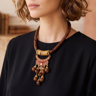 Woman wearing a decorative necklace indoors