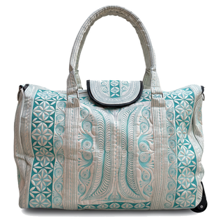 Patterned handbag with a handle on a white background
